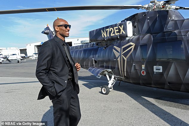Bryant is seen preparing to board a helicopter in Los Angeles in April 2013